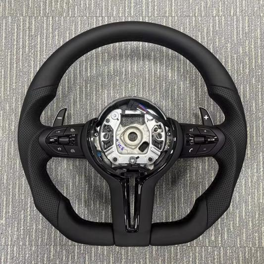 Custom flat-bottom BMW steering wheel with paddle shifters